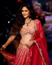 Attractive Mrunal Thakur in a Red Lehenga at Bombay Times Fashion Week Photos 01