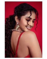 Beautiful Anupama Parameswaran in a Red Flower Printed Saree with Matching Sleevless Blouse Pictures 02