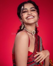 Beautiful Anupama Parameswaran in a Red Flower Printed Saree with Matching Sleevless Blouse Pictures 05