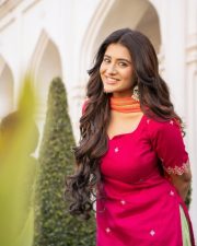 Beautiful Telugu Heroine Rashi Singh in a Rani Pink Kurta with Bright Green Patiala Style Salwar and Orange Dupatta Pictures 01