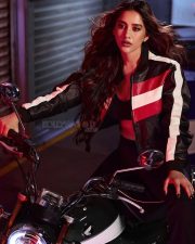Biker Beauty Nabha Natesh in a Stylish Black Red and White Leather Jacket with a Black Sports Bra and Black Pant Photos 01