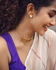 Bubbly Beauty Anupama Parameswaran in a Light Saree with a Sleeveless Purple Blouse Photos 01