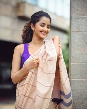 Bubbly Beauty Anupama Parameswaran in a Light Saree with a Sleeveless Purple Blouse Photos 02