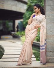 Bubbly Beauty Anupama Parameswaran in a Light Saree with a Sleeveless Purple Blouse Photos 03