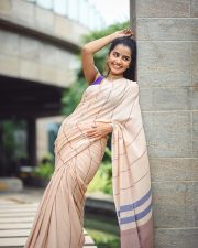Bubbly Beauty Anupama Parameswaran in a Light Saree with a Sleeveless Purple Blouse Photos 06