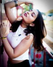 Captivating Actress Ananya Nagalla in a White Crop Top and Denim Shorts Photos 01