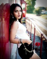 Captivating Actress Ananya Nagalla in a White Crop Top and Denim Shorts Photos 04