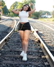 Captivating Actress Ananya Nagalla in a White Crop Top and Denim Shorts Photos 05