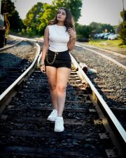 Captivating Actress Ananya Nagalla in a White Crop Top and Denim Shorts Photos 06