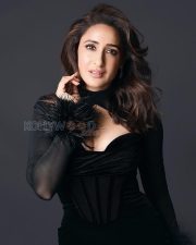 Captivating Actress Pragya Jaiswal in a Black Velvet Feather Cuff Gown Photos 04
