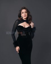 Captivating Actress Pragya Jaiswal in a Black Velvet Feather Cuff Gown Photos 07