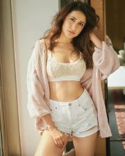 Captivating Pragya Jaiswal in a Chic White Short Dress Photos 03