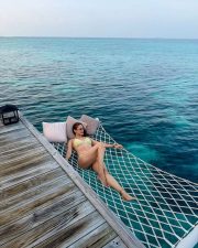 Captivating Pragya Jaiswal in a Two Piece Yellow Triangle Bikini Top and Tie Side Bottoms Photos 02