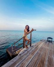 Captivating Pragya Jaiswal in a Two Piece Yellow Triangle Bikini Top and Tie Side Bottoms Photos 03