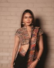 Charming Actress Mrunal Thakur in a burgundy wine sheer traditional saree with draped pallu photos 02
