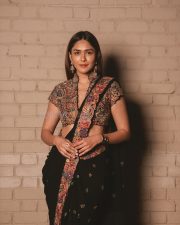Charming Actress Mrunal Thakur in a burgundy wine sheer traditional saree with draped pallu photos 03
