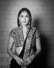 Charming Actress Mrunal Thakur in a burgundy wine sheer traditional saree with draped pallu photos 09
