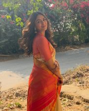 Charming Actress Mrunal Thakur in a pink and cream gradient colorblock oversized shrug with crop top photos 11