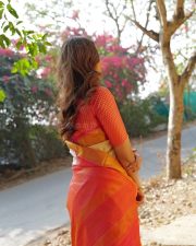 Charming Actress Mrunal Thakur in a pink and cream gradient colorblock oversized shrug with crop top photos 12