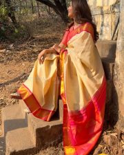 Charming Actress Mrunal Thakur in a pink and cream gradient colorblock oversized shrug with crop top photos 13