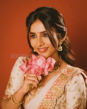 Charming Actress Nabha Natesh in a Ivory Embroidered Lehenga With Orange Accents Photos 01