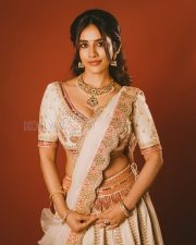 Charming Actress Nabha Natesh in a Ivory Embroidered Lehenga With Orange Accents Photos 02
