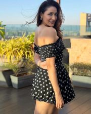 Charming Actress Pragya Jaiswal in a Black Polka Dot Off Shoulder Mini Dress Photos 01