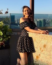 Charming Actress Pragya Jaiswal in a Black Polka Dot Off Shoulder Mini Dress Photos 03