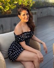 Charming Actress Pragya Jaiswal in a Black Polka Dot Off Shoulder Mini Dress Photos 04