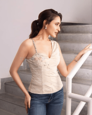 Charming Actress Pragya Jaiswal in a Ivory Embellished Corset Top And Jeans Photos 03