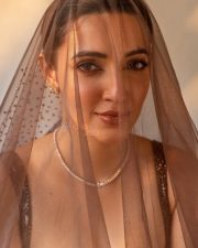 Charming Beauty Neha Shetty in a Golden Lehenga with Sleeveless Blouse Photos 01