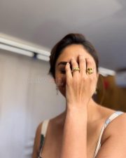 Charming Mrunal Thakur in a White Floral Printed Dress Photos 05