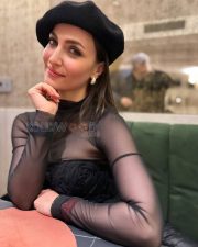 Chic Actress Elli Avrram in a Black sheer mesh turtleneck and floral corset Photos 02