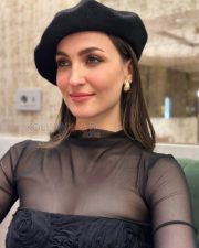 Chic Actress Elli Avrram in a Black sheer mesh turtleneck and floral corset Photos 03