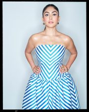 Chic Actress Mrunal Thakur in a Blue White Striped Strapless Gown Photos 01