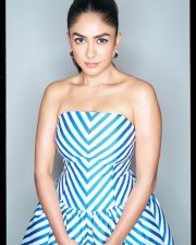 Chic Actress Mrunal Thakur in a Blue White Striped Strapless Gown Photos 04