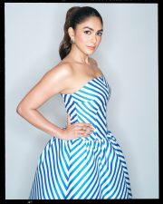 Chic Actress Mrunal Thakur in a Blue White Striped Strapless Gown Photos 06