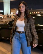 Chic Actress Mrunal Thakur in a White Tank Top and Plaid Shirt Photos 02