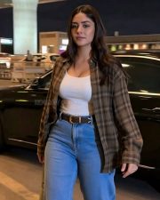 Chic Actress Mrunal Thakur in a White Tank Top and Plaid Shirt Photos 02