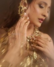 Classy Pragya Jaiswal in a Sleeveless Metallic Gold Embellished Long Dress Pictures 03