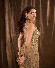Classy Pragya Jaiswal in a Sleeveless Metallic Gold Embellished Long Dress Pictures 04