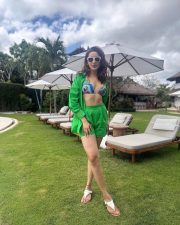 Confident Pragya Jaiswal in a Stylish Green Shorts with a Printed Bikini Photos 03