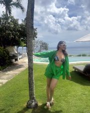 Confident Pragya Jaiswal in a Stylish Green Shorts with a Printed Bikini Photos 04