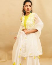 Cute Anupama Parameswaran in a White and Yellow Embroidered Lehenga with Sleeveless Halter Neck Blouse Photos 02