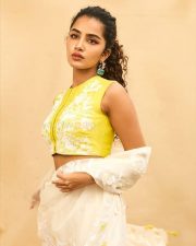 Cute Anupama Parameswaran in a Yellow Silk Chanderi Crop Top with a Matching High Waisted Sharara and Sheer Dupatta Pictures 02
