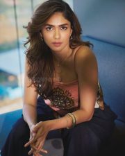 Dacoit A Love Story Actress Mrunal Thakur in a Silk Satin Halter Neck Scarf Top with a Navy Blue Wide Leg Trousers photos 02