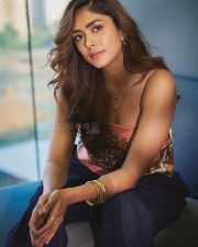 Dacoit A Love Story Actress Mrunal Thakur in a Silk Satin Halter Neck Scarf Top with a Navy Blue Wide Leg Trousers photos 03