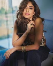 Dacoit A Love Story Actress Mrunal Thakur in a Silk Satin Halter Neck Scarf Top with a Navy Blue Wide Leg Trousers photos 04