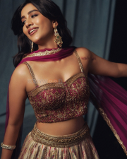 Dazzling Actress Nabha Natesh in a Magenta Embroidered Lehenga Photos 01