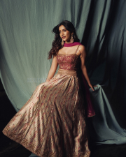 Dazzling Actress Nabha Natesh in a Magenta Embroidered Lehenga Photos 07